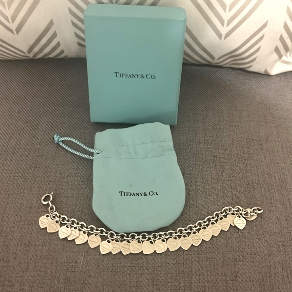 Tiffany & Co. 7 1/2 bracelet. 20 heart shape stamps.